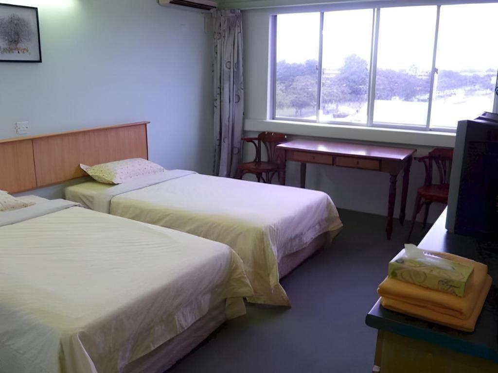 Hotel Hung Hung Кучинг Экстерьер фото